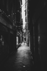 Narrow alley amidst buildings in city