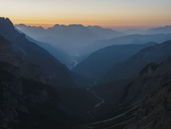 Scenic view of mountains against sky during sunset