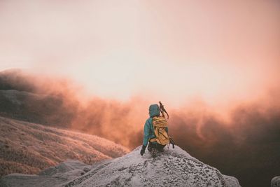 Scenic view of mountains against sky at sunset