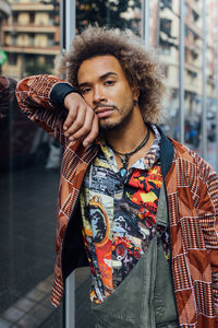 Portrait of young man standing outdoors