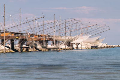 View of pier over sea against sky