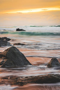 Scenic view of sea against sky during sunset