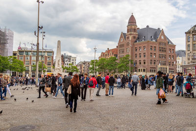 Group of people in front of buildings