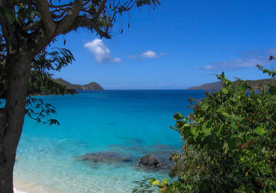 Scenic view of sea against blue sky