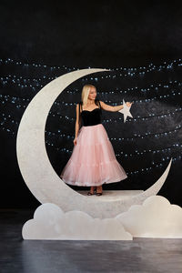 Rear view of woman standing against sky