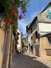 Street amidst buildings against sky