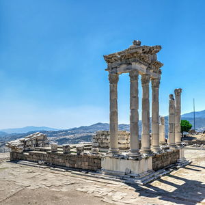 Ancient temple against sky in city