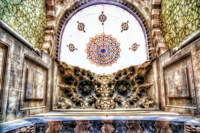 Low angle view of ornate window in building