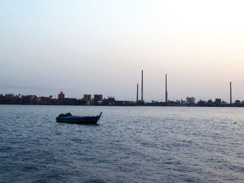 Scenic view of sea against clear sky during sunset