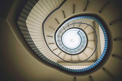 Directly below view of spiral staircase in building