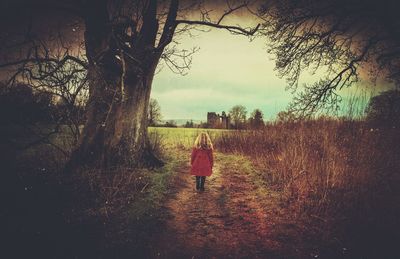 People walking on grassy field