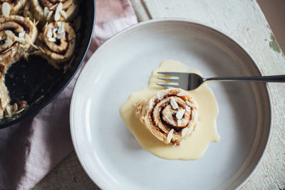 High angle view of cinnamon roll on plate