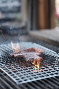 Close-up of meat on barbecue grill