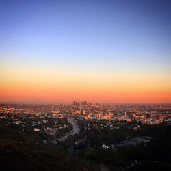 Aerial view of city at sunset