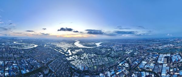 Aerial view of cityscape against sky