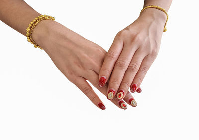 Close-up of woman hand against white background