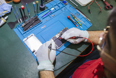 High angle view of man using mobile phone