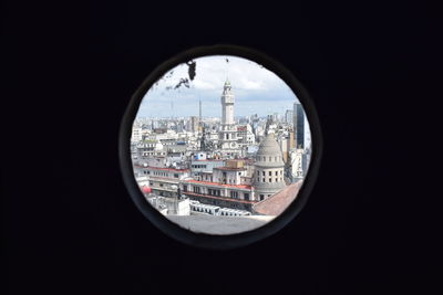 Cityscape seen through glass window