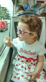 Portrait of cute girl in sunglasses