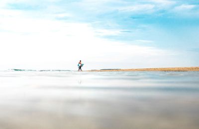 Silhouette of people in water