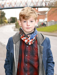 Portrait of boy standing outdoors