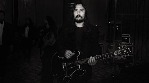 Portrait of man playing guitar