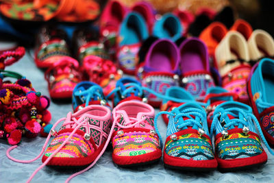 Multi colored shoes at market for sale