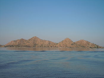 Scenic view of calm sea against clear sky