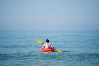 man paddling a