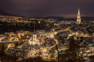 Aerial view of city lit up at night