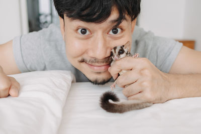 Portrait of cute boy lying on bed