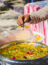 Midsection of person preparing food