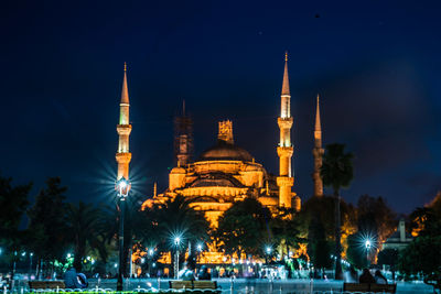 Illuminated cathedral against sky at night