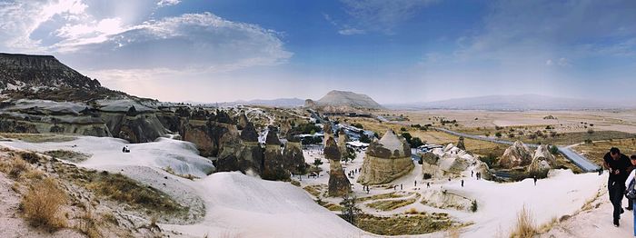 Panoramic view of snowcapped mountains against sky