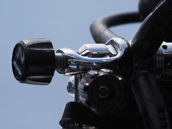 Low angle view of metal against sky