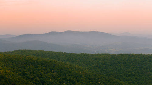 Scenic view of mountains against sky during sunset