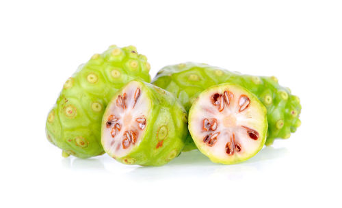 Close-up of fruits against white background