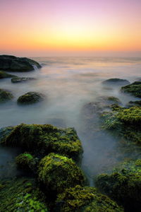 Scenic view of sea against sky during sunset