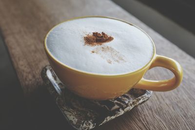 High angle view of coffee cup on table