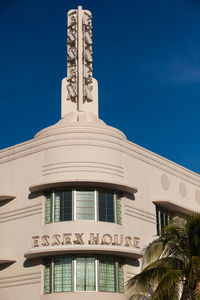 Low angle view of building against blue sky