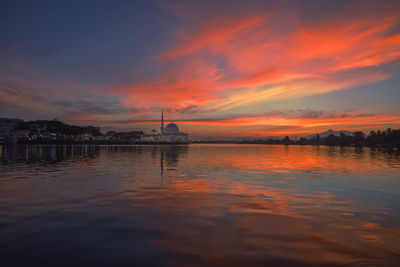 Scenic view of sea against orange sky