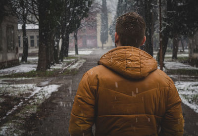 Rear view of man during winter