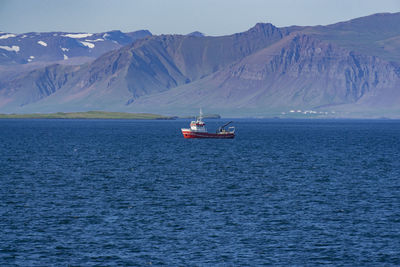 Scenic view of sea against mountains