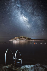 Scenic view of sea against sky at night