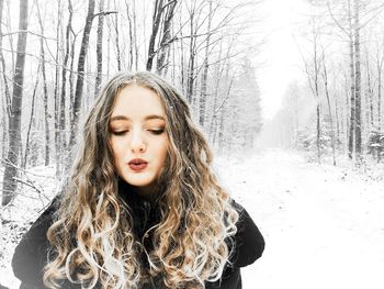 Portrait of teenage girl in snow