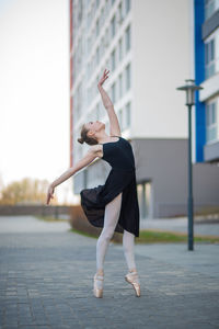 Full length of woman dancing outdoors