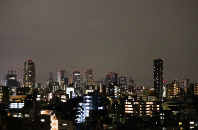 Illuminated cityscape at night