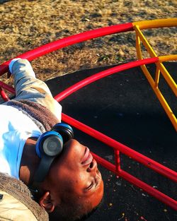 High angle view portrait of young man in playground