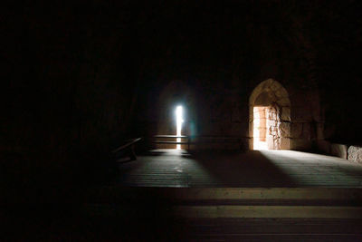 Illuminated tunnel at night