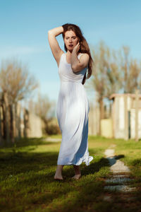 Young woman standing on field